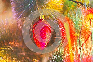 Christmas decorations and colored lights garlands on Christmas tree. Bright lights and highlights against background of