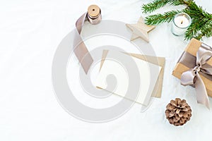 Christmas decorations composition. Decorative corner.Christmas blank greeting card mock-up scene. Gift christmas box with ribbon,