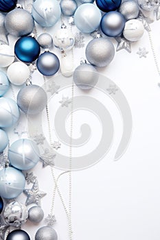 Christmas decorations concept. Top view vertical photo of blue white silver baubles snowflake star ornaments and