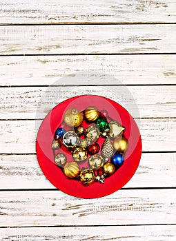 Christmas decorations design of Xmas balls ornaments on red plate