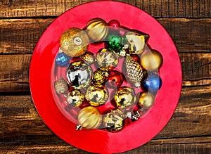 Christmas decorations design of Xmas balls ornaments on red plate