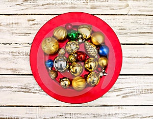 Christmas decorations design of Xmas balls ornaments on red plate