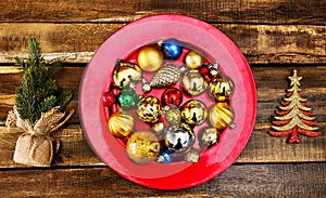 Christmas decorations design of Xmas balls ornaments on red plate