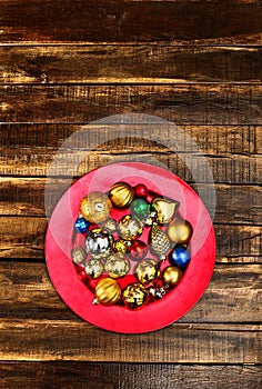 Christmas decorations design of Xmas balls ornaments on red plate