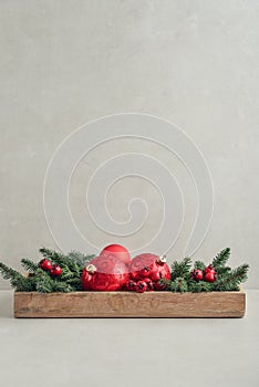 Christmas decorations from fir tree branches and red christmas balls