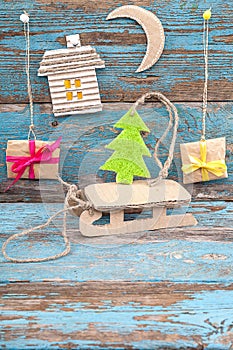 Christmas decorations with fir tree, sleigh and gifts