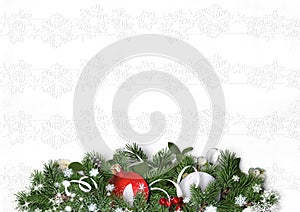 Christmas decorations and firtree on a white textural background