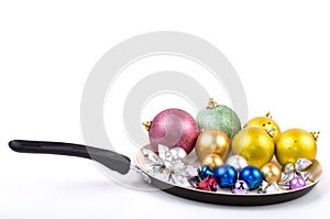 Christmas decorations on frying pan