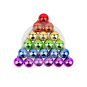 Christmas decorations glass balls pyramid LGBTQ community rainbow flag color white background isolated closeup, LGBT pride symbol