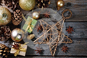 Christmas decorations with golden balls, gifts, pine cones and big star , horizontal banner