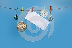 Christmas decorations hang on a rope. Christmas card