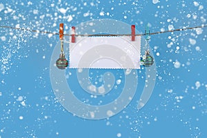 Christmas decorations hang on a rope. Christmas card