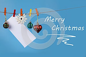 Christmas decorations hang on a rope. Christmas card