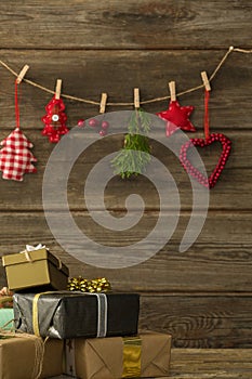 Christmas decorations hanging against wooden wall