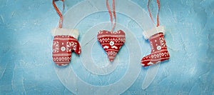 Christmas decorations hanging on a blue background