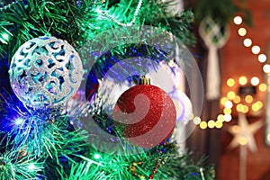 Christmas decorations hung on the Christmas tree. Merry Christmas