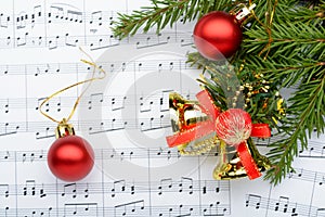 Christmas decorations lying on notes sheet