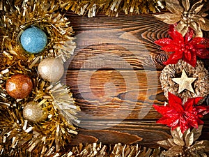 Christmas decorations. Mock up vintage New Year decorations on dark wooden background with copy space. Frame with garlands, balls
