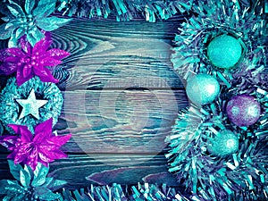 Christmas decorations. Mock up vintage New Year decorations on dark wooden background with copy space. Frame with garlands, balls