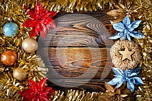 Christmas decorations. Mock up vintage New Year decorations on a dark wooden background. Frame with garlands, balls, stars and