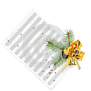 Christmas decorations and music sheet isolated on white