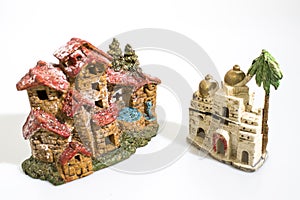 Christmas decorations, nativity scene houses isolated in a white