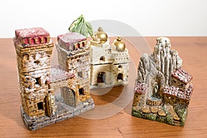 Christmas decorations, nativity scene houses on a wood table