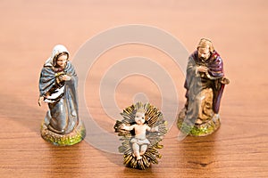 Christmas decorations, nativity scene statues on a wood table