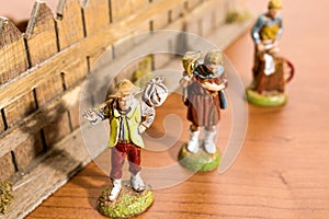 Christmas decorations, nativity scene statues on a wood table