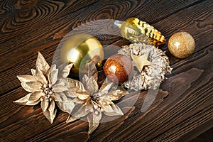Christmas decorations. New Year`s decorations on a dark wooden background. Garlands, balls and toys for Christmas decor. Festive