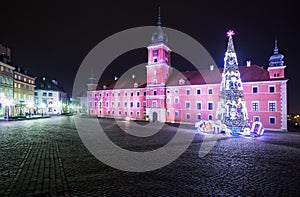 Christmas decorations on the old town of Warsaw at night.Royal C