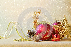 Christmas decorations over glitter sparkle background