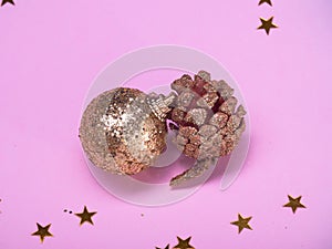 Christmas decorations on a pink background.