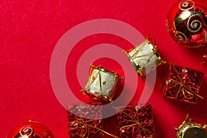 Christmas decorations on a red background. Holiday decorations. Red gift boxes. golden toy drums. Christmas concept.