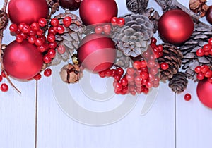 Christmas decorations-red balls and fir cones on white background