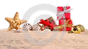 Christmas decorations seashells and starfish on a beach sand on