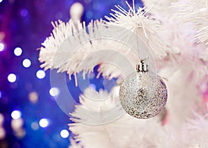 Christmas decorations, silver ball hanging on the decorative christmas tree. Holidays concept