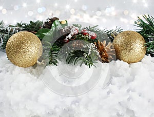 Christmas decorations in snow with bokeh lights background