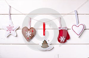 Christmas decorations with stars and tree on white wooden background. Xmas and Happy New Year composition. Horizontal.