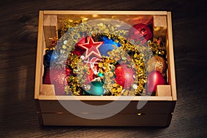 Christmas decorations stored in wooden box photo