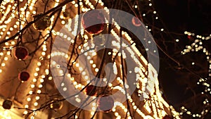 Christmas decorations on the street, festive balls on trees, night scene