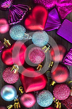 Christmas decorations. Vertical composition. Many small colourful hearts, balls and candies for Christmas tree. Holiday