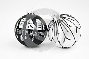 Christmas decorations on white ground: two modern Christmas balls with decoration