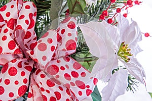 Christmas decorations - white Poinsettia with red and white bow