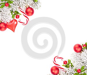 Christmas decorations. Winter fir branches, sweets, berries and red glass baubles isolated on white background. Xmas corner