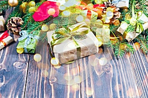 Christmas decorations. Wooden background and table. Gifts and baubles.