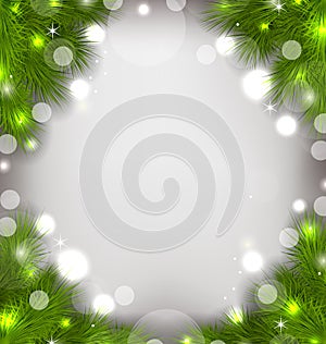 Christmas decorative border from fir twigs, glowing background