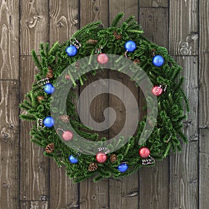 Christmas decorative wreath with balls on wood