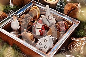 Christmas decors in wooden shadow box lying on the table