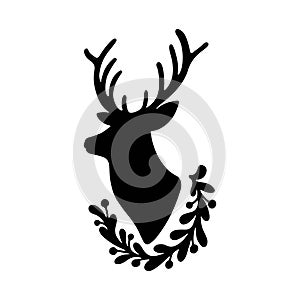 Christmas deer silhouette with floral wreath isolated on white background. New Year elegant winter reindeer decoration
